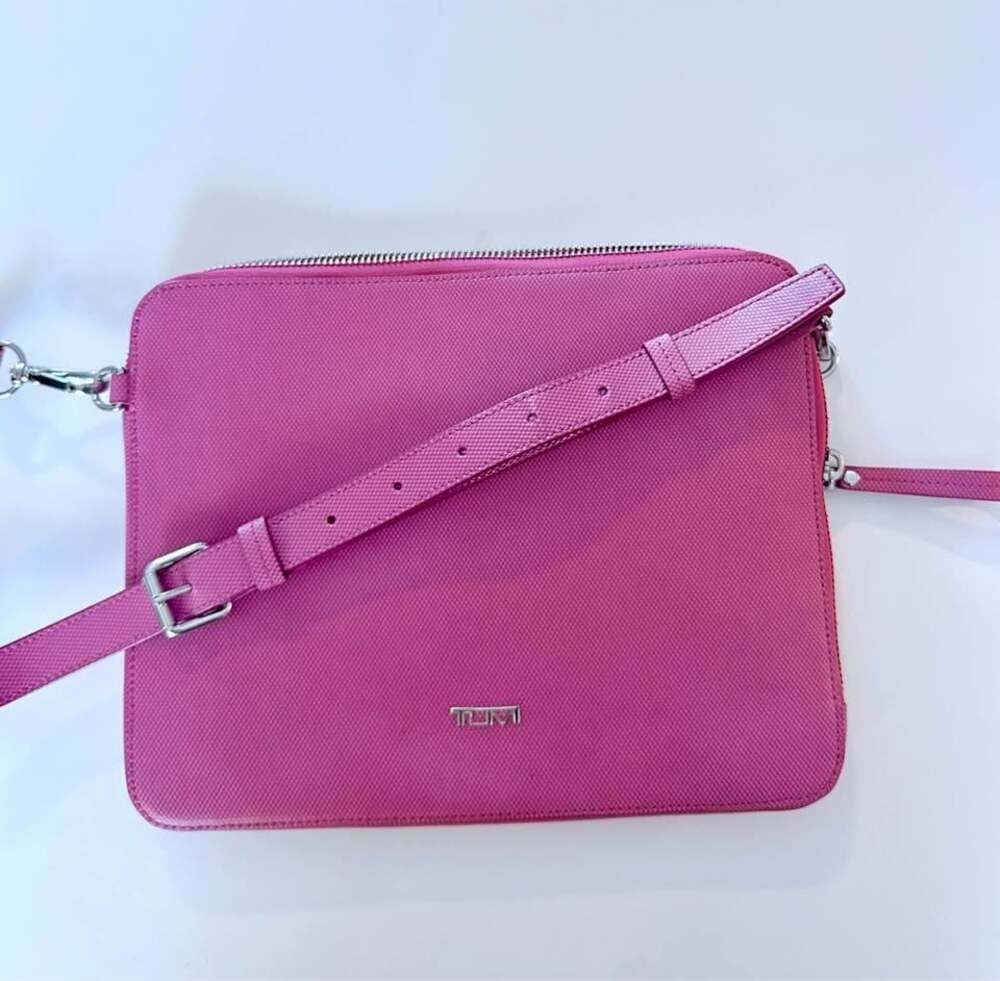 Tumi Pink Leather Slim Zip
Crossbody Bag